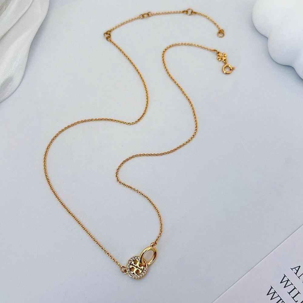 Tory Burch Elegant Gold Necklace with Crystal Accents